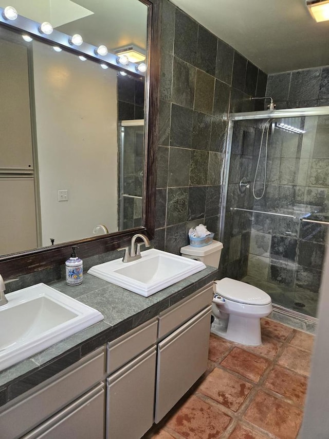 bathroom with toilet, vanity, tile walls, and walk in shower