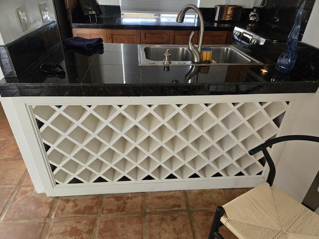 kitchen featuring sink and tile patterned flooring