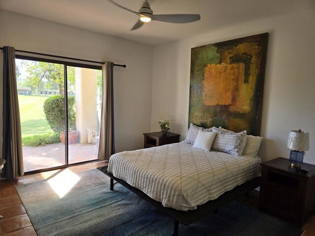 bedroom featuring ceiling fan and access to exterior