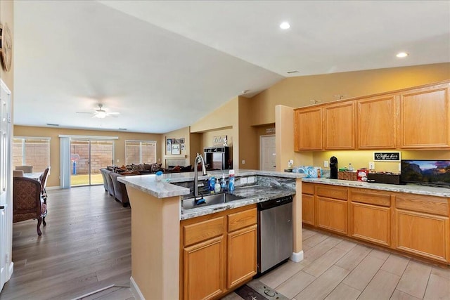 kitchen with dishwasher, lofted ceiling, sink, light hardwood / wood-style flooring, and ceiling fan