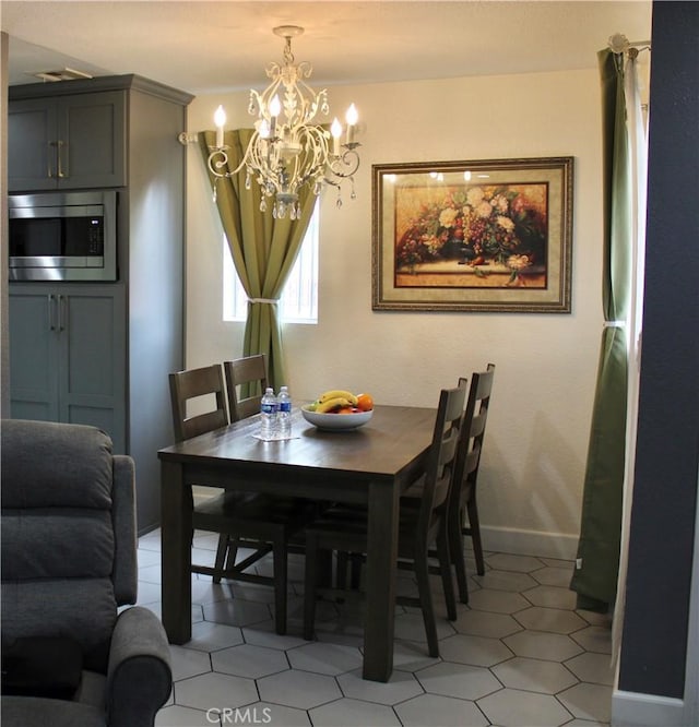 dining room featuring a notable chandelier