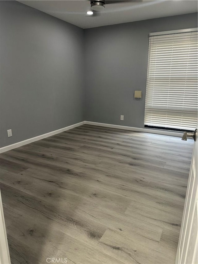 spare room featuring hardwood / wood-style floors