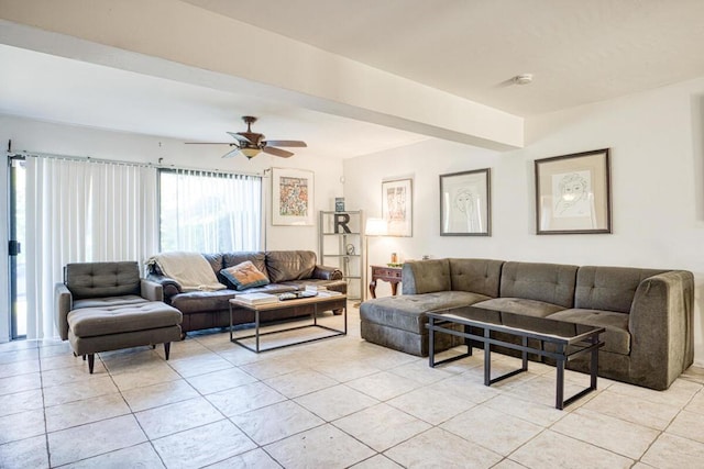 living room with ceiling fan and light tile patterned flooring