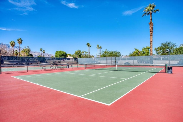 view of tennis court featuring basketball court