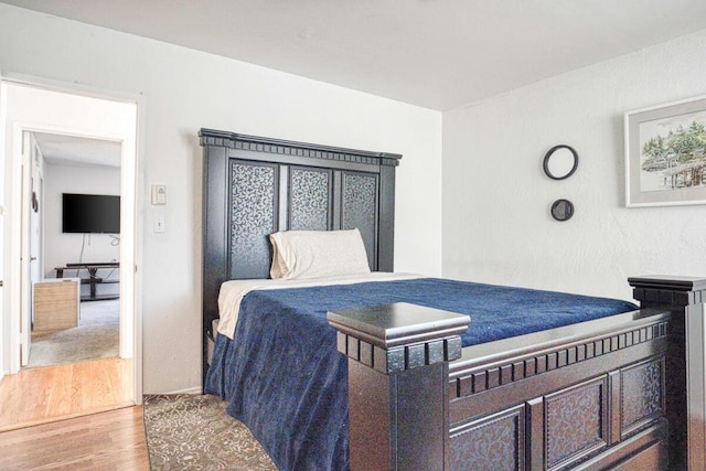 bedroom with wood-type flooring