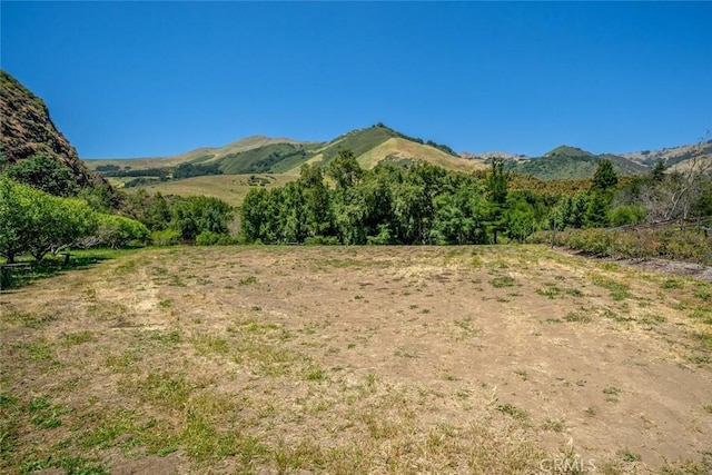 property view of mountains featuring a rural view