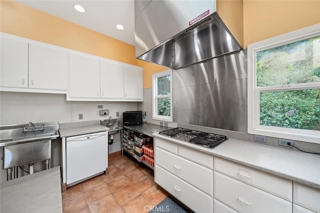 kitchen featuring extractor fan, white cabinets, stainless steel gas cooktop, white dishwasher, and plenty of natural light