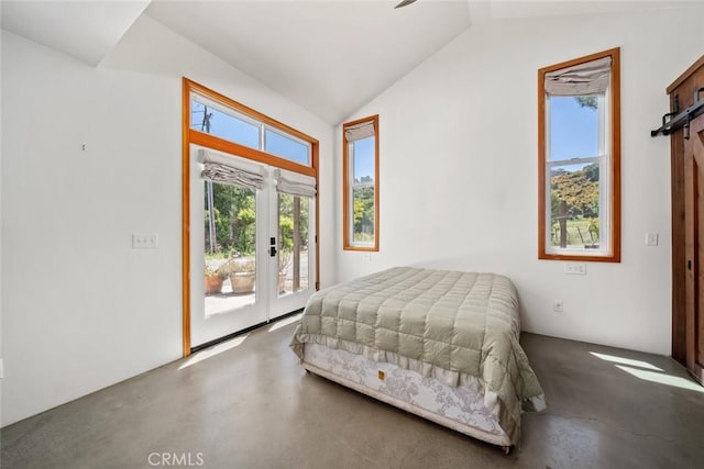 bedroom featuring lofted ceiling, access to exterior, and french doors