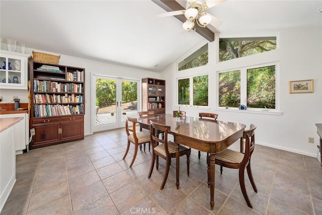 dining space with french doors, ceiling fan, lofted ceiling with beams, and light tile patterned floors