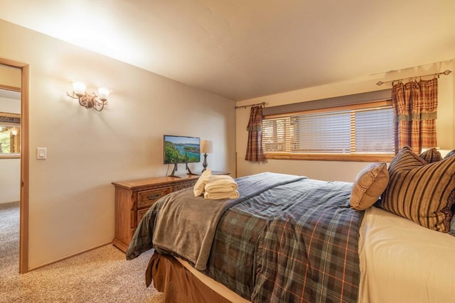 bedroom featuring light carpet