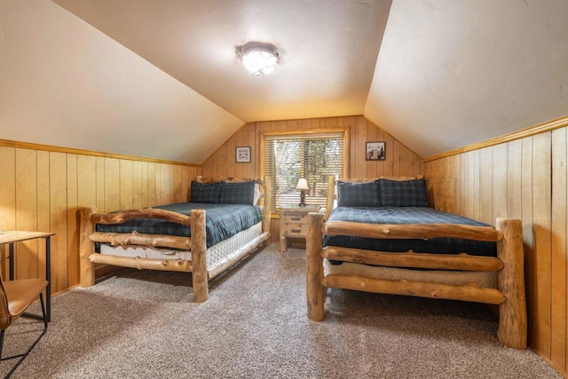 bedroom with wooden walls, lofted ceiling, and carpet