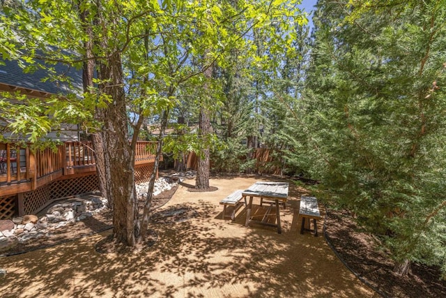 view of yard featuring a wooden deck