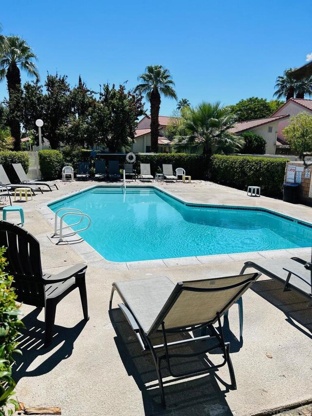 view of swimming pool with a patio