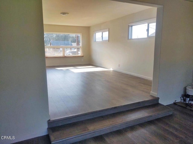 unfurnished room with wood-type flooring