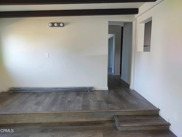 spare room with dark wood-type flooring