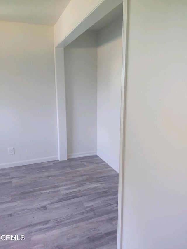 unfurnished room featuring hardwood / wood-style flooring