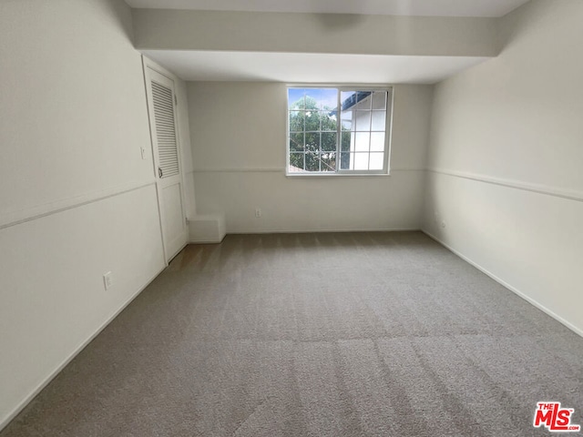 unfurnished room featuring carpet flooring