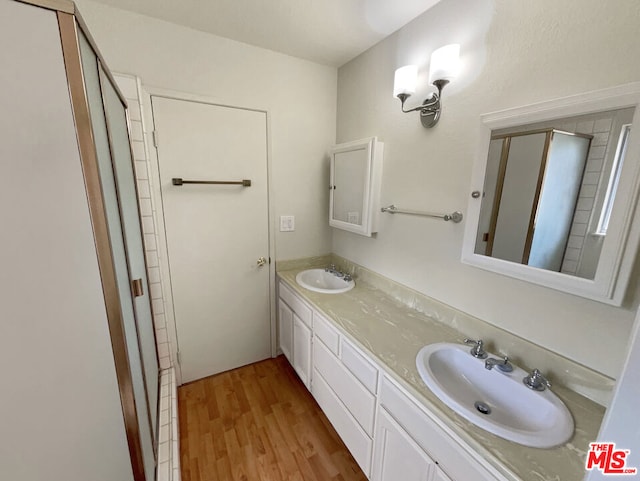 bathroom with vanity and hardwood / wood-style flooring