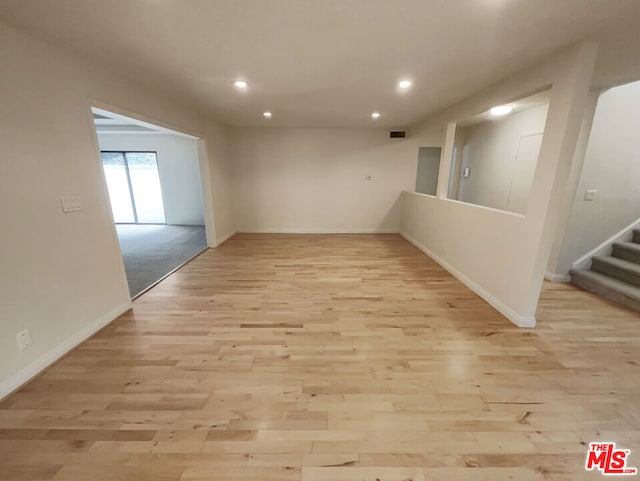 spare room featuring light hardwood / wood-style flooring