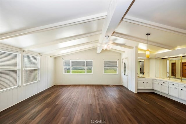 interior space with hardwood / wood-style flooring, vaulted ceiling with beams, and ceiling fan