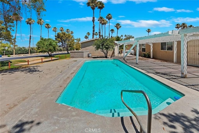 view of swimming pool featuring a pergola and a patio area