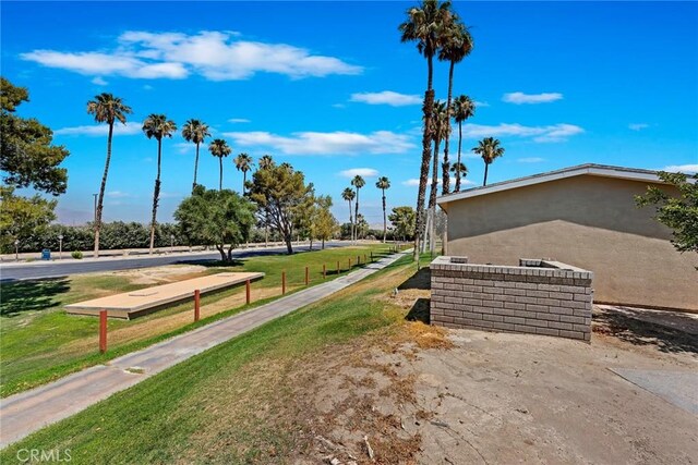 view of community featuring a yard