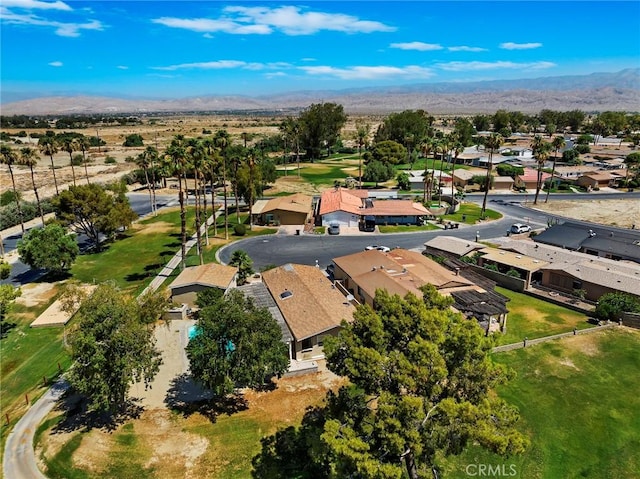 birds eye view of property with a mountain view