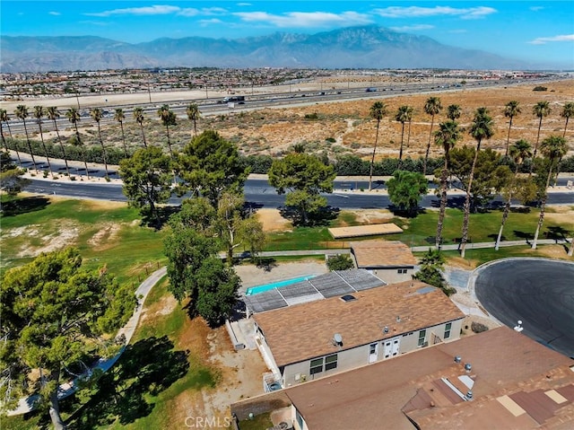 birds eye view of property with a mountain view