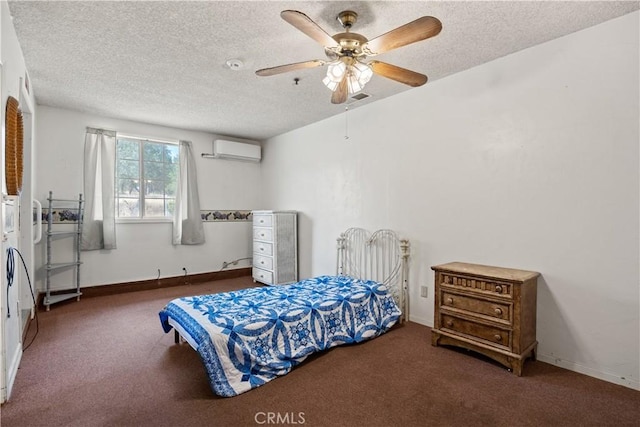 carpeted bedroom with a wall mounted AC, a textured ceiling, and ceiling fan