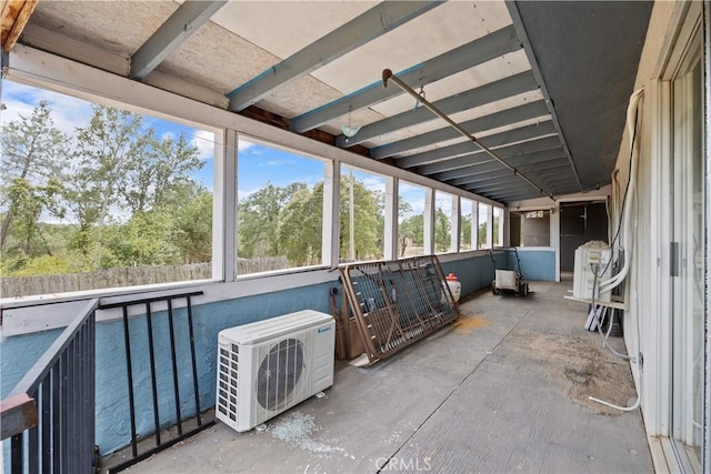 unfurnished sunroom with ac unit