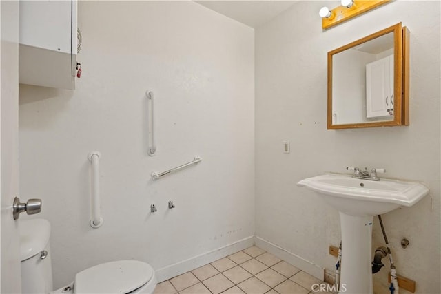 bathroom with tile patterned floors, sink, and toilet