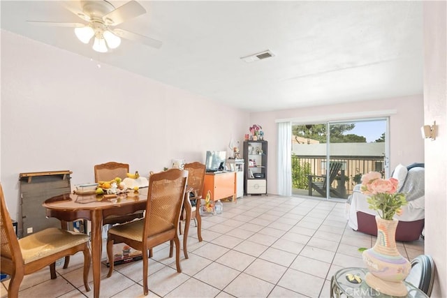 dining space featuring ceiling fan and light tile patterned flooring