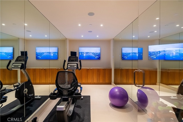 workout room with light tile patterned flooring