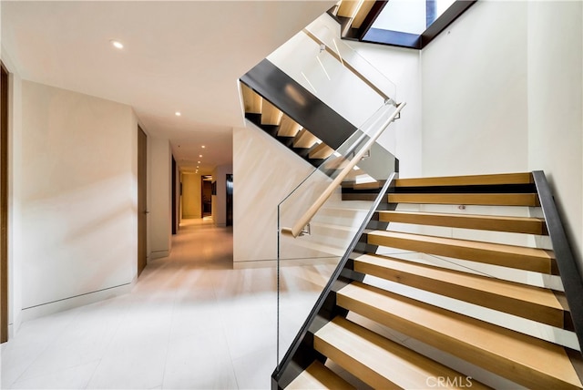 stairway featuring tile patterned floors