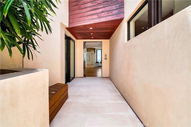 hall with light tile patterned floors