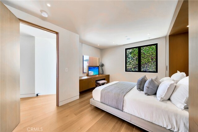 bedroom with light hardwood / wood-style floors