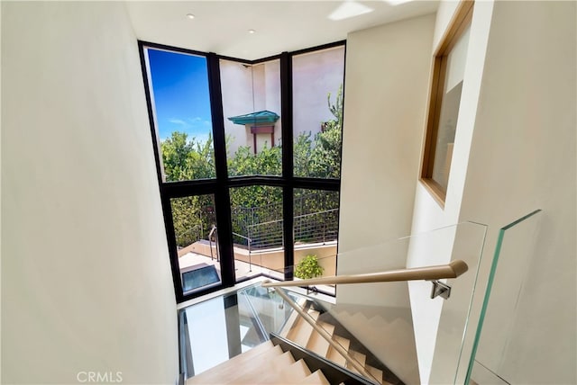 stairs with expansive windows