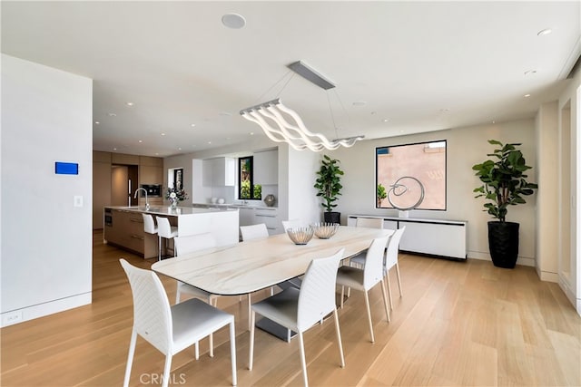 dining room with light hardwood / wood-style floors