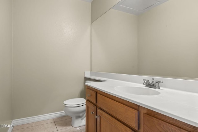 bathroom with tile patterned floors, vanity, and toilet