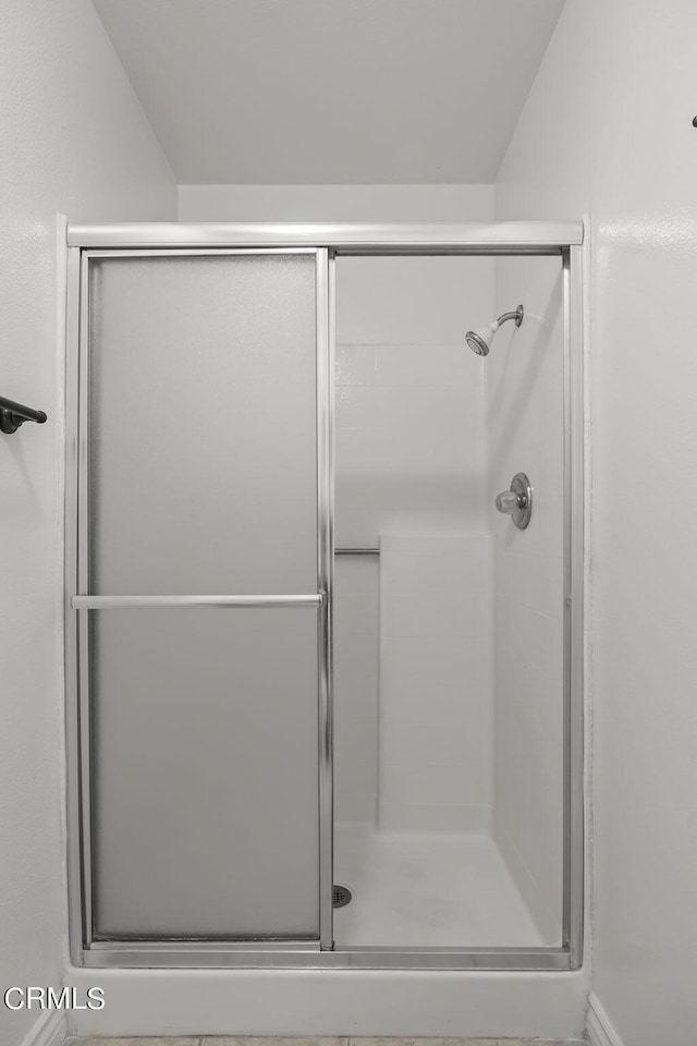 bathroom featuring an enclosed shower