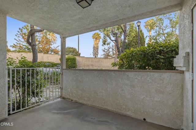 view of patio featuring a balcony