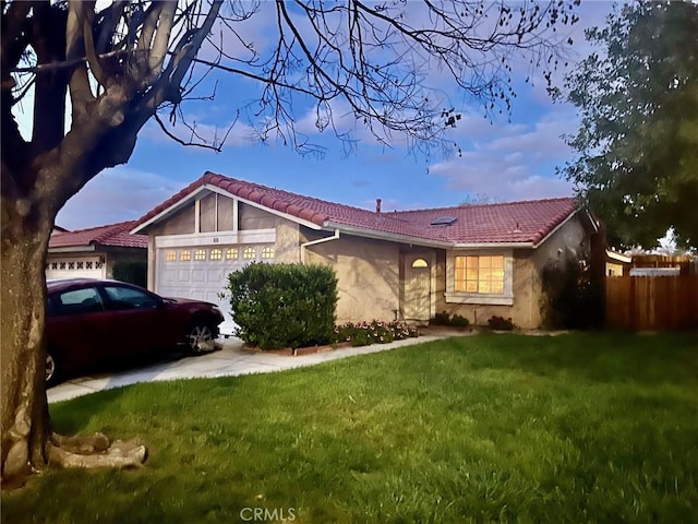 810 Santa Fe Ln, Colton, CA 92324 - ranch-style house with a tiled roof, stucco siding, a garage, and a front lawn