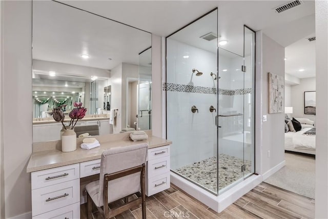 bathroom featuring vanity and an enclosed shower