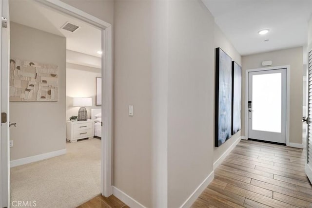 hallway featuring light hardwood / wood-style flooring