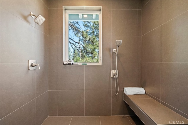 bathroom with tiled shower