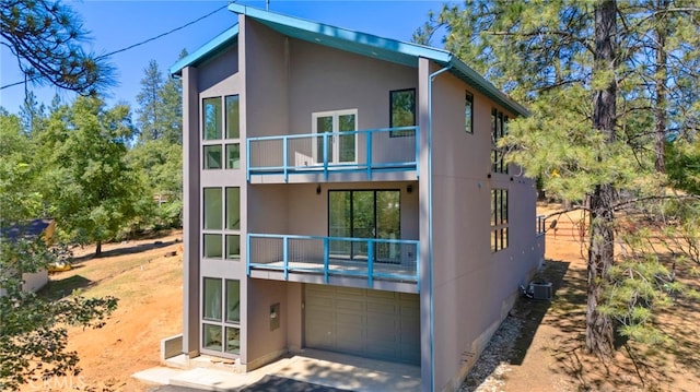 rear view of property with a garage