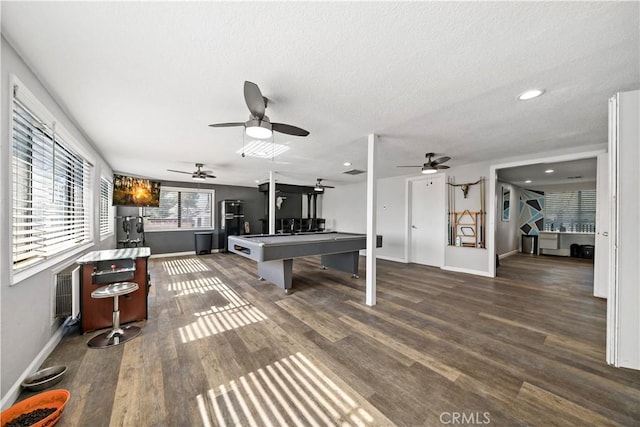 7410 Frontera Ave, Yucca Valley, CA 92284 - game room with dark wood-type flooring and a textured ceiling