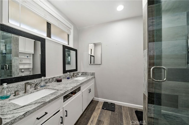 7410 Frontera Ave, Yucca Valley, CA 92284 - bathroom with hardwood / wood-style flooring, vanity, and a shower with door