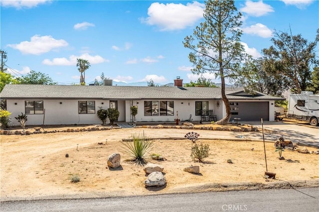 ranch-style house featuring a garage