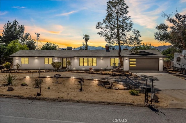 ranch-style house featuring a garage